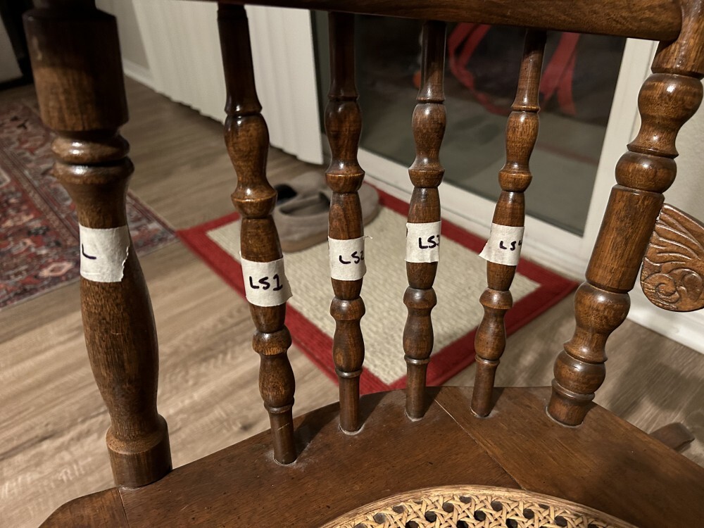 letter labels LS1 through LS4, in permanent marker on masking tape, applied to spindles beneath one arm of the chair.